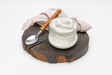 bowl of yogurt on a plank - 495533854