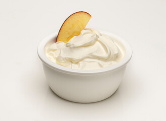 yogurt and an apple slice - 495533867