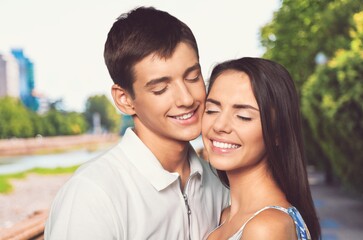 Obraz premium Caucasian young loving couple concept. Couple embracing road travel. Sunset scene.