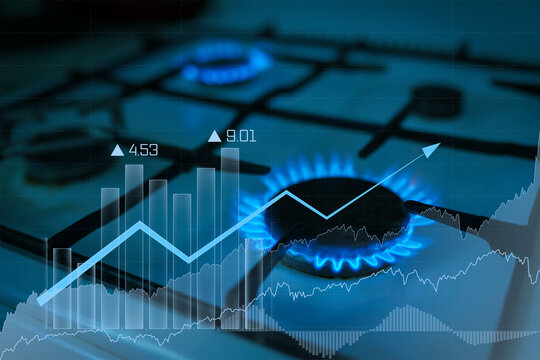 Gas Flame From The Gas Burner With The Natural Gas Price Chart Tending Upwards. Concept Of Problems With Natural Gas, Rising Prices.