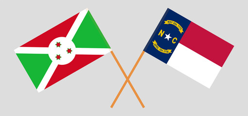 Crossed flags of Burundi and The State of North Carolina. Official colors. Correct proportion