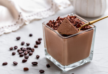 Chocolate and coffee bavaroise cream or jelly mousse served in a glass with dark chocolate crumbs...
