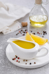 Classic Vinaigrette or Citronette salad dressing with oil, lemon juice, salt and pepper served in...