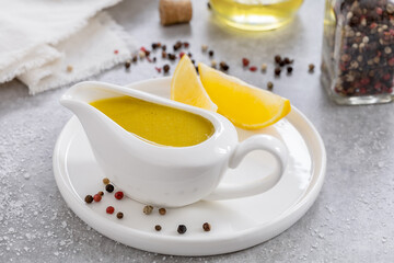 Vinaigrette sauce. Basic Vinaigrette or Citronette salad dressing with oil, lemon juice, salt and...