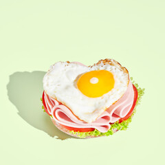 Fresh and tasty sandwich on green pastel background