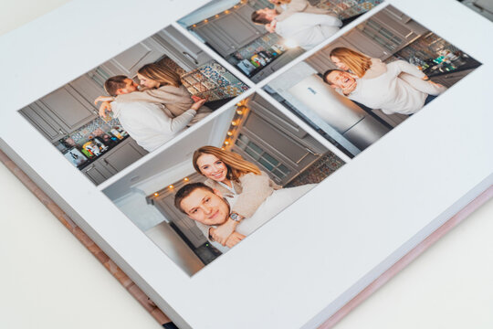 a book with photos of couple at home on a white background.