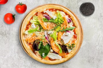 Pizza with cheese, tomato sauce and basil on table, top view