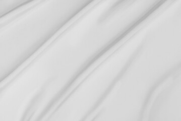 Fototapeta na wymiar White silk satin background. Wave texture background