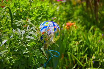 Beautifully maintained cottage garden with a decorative ball, in Bavaria, Southern Germany. Detail.