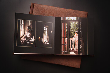 wedding photobooks in brown leather binding with photos on the cover