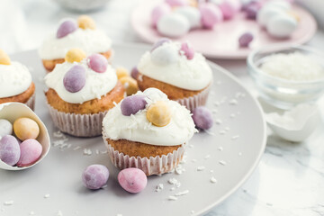 Glazed Easter cupcakes decorated with mini chocolate eggs