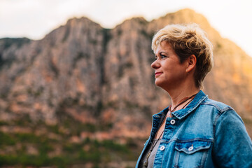 portrait of a modern adult woman, on holiday in a rural village on holiday.