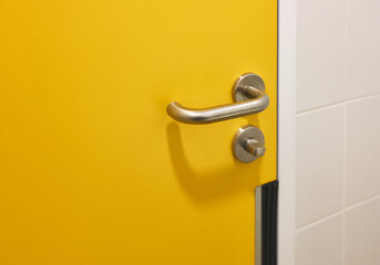 door handle in a public restroom