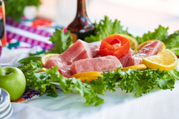Traditionally made Mexican ceviche. Fish strips with tomato, lettuce, onion, avocado, orange.