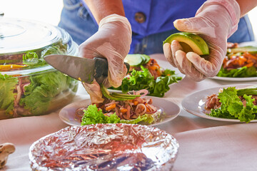 Traditionally made Mexican ceviche. Fish strips with tomato, lettuce, onion, avocado, orange.