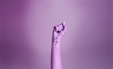 Purple hand of a woman for international women's day and the feminist movement. Activism for women rights - obrazy, fototapety, plakaty