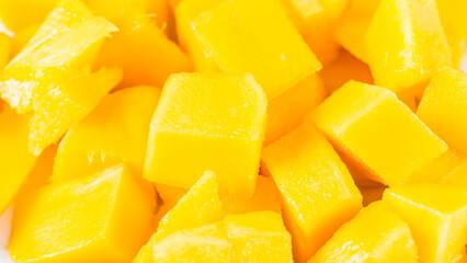 plate with pieces of mango on the table, close-up