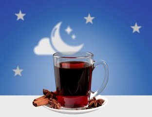 Sleeping concept. Tea with chamomile from teapot into mug at night over moon background
