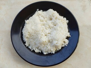 White rice on the black plate