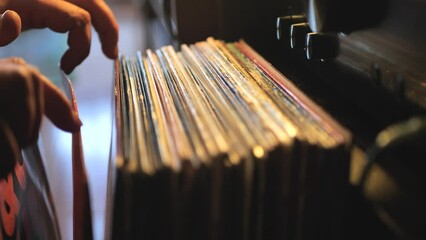 Close up man hands browsing vintage vinyl records at home. Searching music. Scene A. - Powered by Adobe
