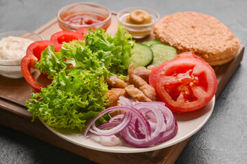 Plate with ingredients for fresh doner kebab on dark background
