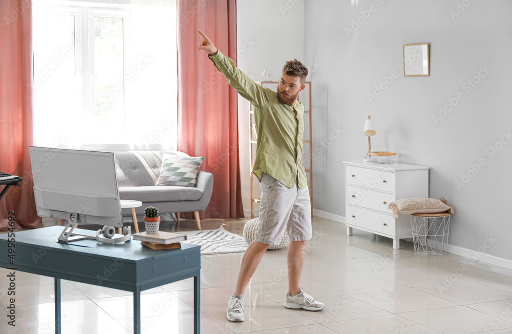 Poster Cool young man learning to dance at home