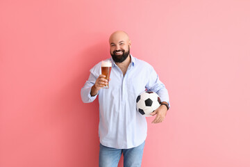 Bald man with beer and soccer ball on color background