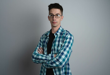 A male person in photo studio looking straight at camera 