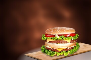 Burger with salad, cheese and bacon.