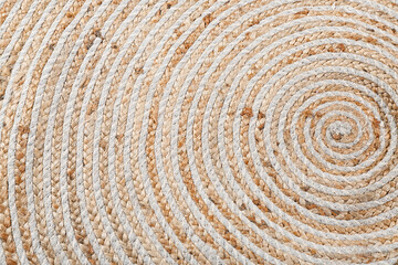 Round wicker carpet as background, closeup