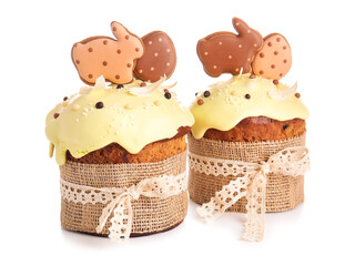 Delicious Easter cakes decorated with cookies on white background