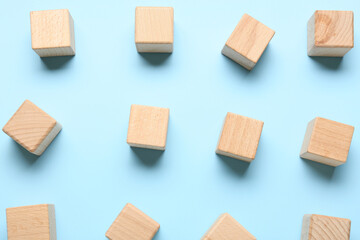Wooden cubes on blue background