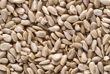 Peeled sunflower seeds full frame background. Close-up. Top view. Close-up shelled sunflower seeds.
