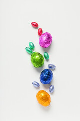 Composition with chocolate Easter eggs isolated on white background