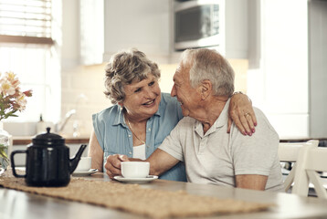 Bonding over a cup of tea. Shot of a senior couple having breakfast together at home.