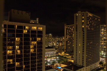 The high rise hotels and resorts loom over the Waikiki Beach neighborhood of Honolulu