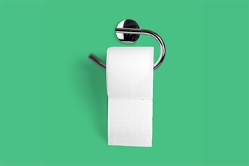 Holder with white toilet paper roll on color background