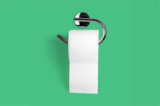 Holder With White Toilet Paper Roll On Color Background