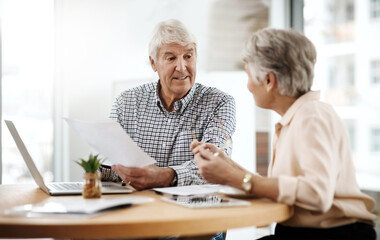 Our finances are in great shape. Cropped shot of a senior couple working on their finances at home.