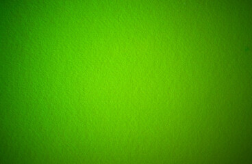 Soft green background. Photo of the texture of green felt fabric. Light green textiles.