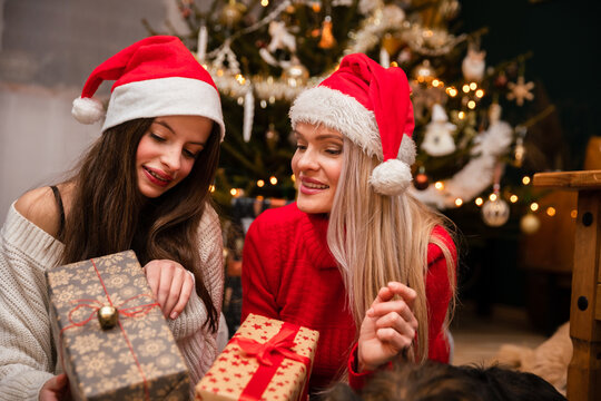Mom and daughter look over gifts received during Christmas.