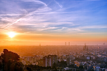 Fototapeta na wymiar The skyline of Barcelona in Spain at a misty sunrise