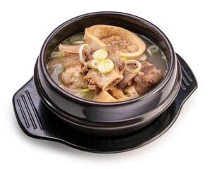 Beef bone marrow soup in hot iron pot isolated on white background, Beef Stock Bone soup or Seolleongtang in iron pot on white With clipping path.