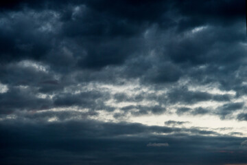 Naklejka na ściany i meble Dark and dramatic storm clouds on the sky