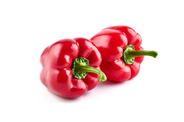 Red ripe bell peppers, isolated on white background.
