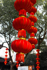 Strings of red lanterns hanging in the park during Chinese New Year