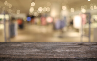 Empty wooden table in front of abstract blurred background of coffee shop . can be used for display or montage your products.Mock up for display of product