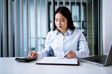 Portrait of  Asian Business woman boring job. routine employees Bored executive sitting in office with office