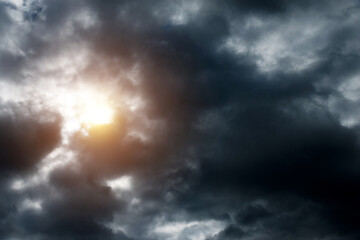 Fototapeta na wymiar Light in the dramatic storm clouds