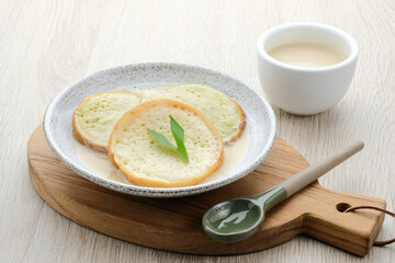 Serabi or Surabi,  Indonesian pancake made of flour, rice flour and coconut milk. Served with palm sugar sauce. Sweet and savory. 
